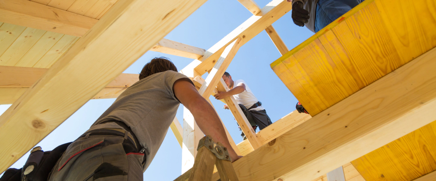 men constructing a residential roofing